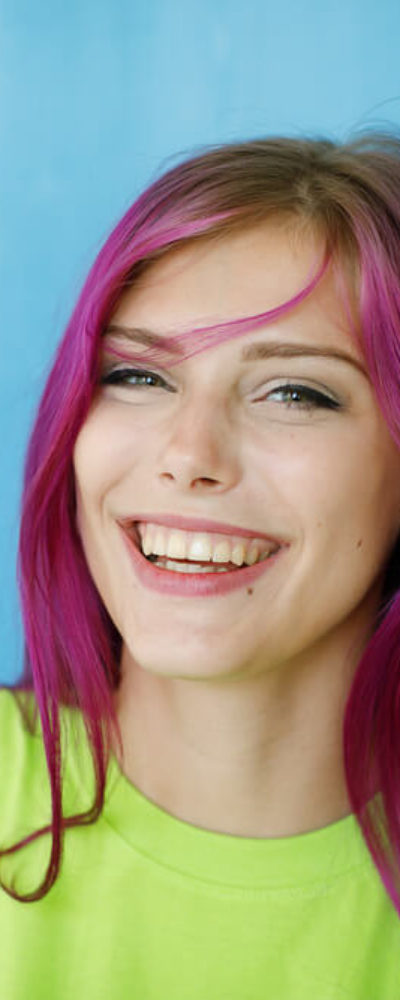 Young, beautiful woman with dyed, purple hair.