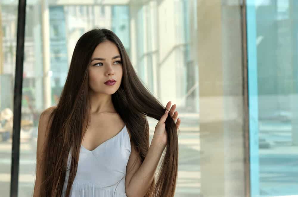Brunette with .long and straight hair.