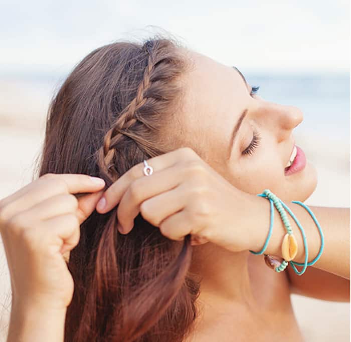 Step 2 for Greek braids - The second step is to apply a 3-strand braid to your bangs along your hairline