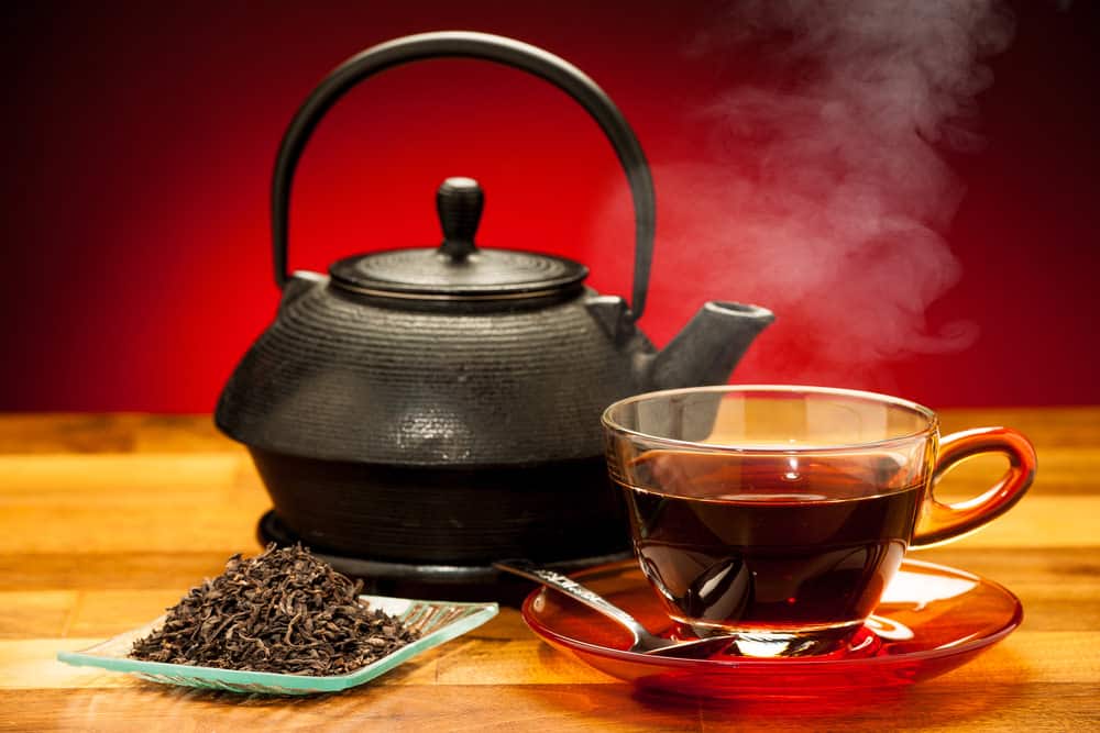 Photo of black tea and kettle