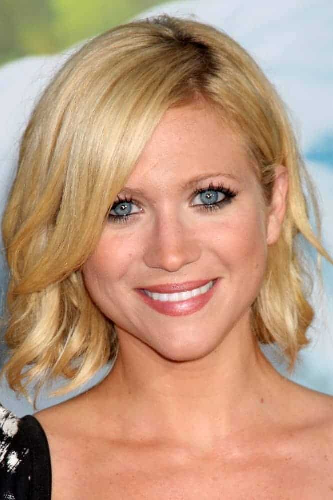 Brittany Snow was at the "Charlie St. Cloud" Premiere at Village Theater on July 20, 2010 in Westwood, CA. She paired her lovely floral dress with a chin-length blonde bob hairstyle with layers and long side-swept bangs.