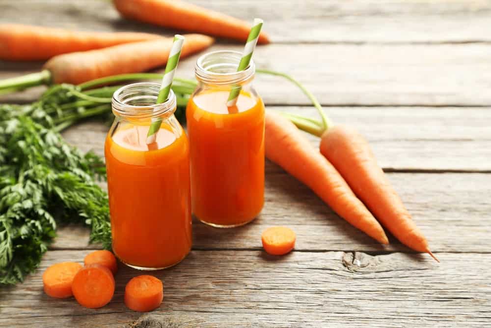 Two glasses of fresh carrot juice.