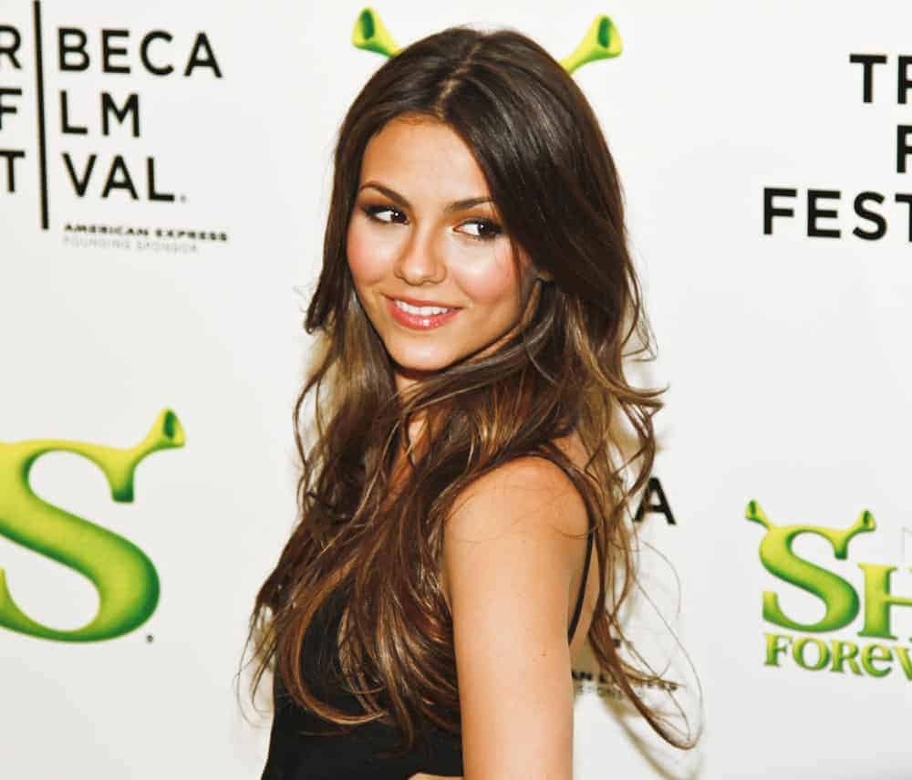 Victoria Justice attended the premiere of "Shrek Forever After" at the 2010 Tribeca Film Festival at the Ziegfeld Theatre on April 21, 2010, in NYC. She wore a simple black dress to go with her long and wavy highlighted layers loose on her shoulders.