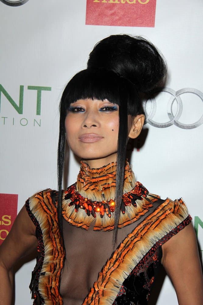 Bai Ling is known for her unconventional style. If you’re this brave then go for a big, bold bun. Unless you have dreads or very long hair you’ll probably need a bun donut to get this much volume. Wrap the hair around and piece it out, using hairspray to build volume and keep everything in place.
