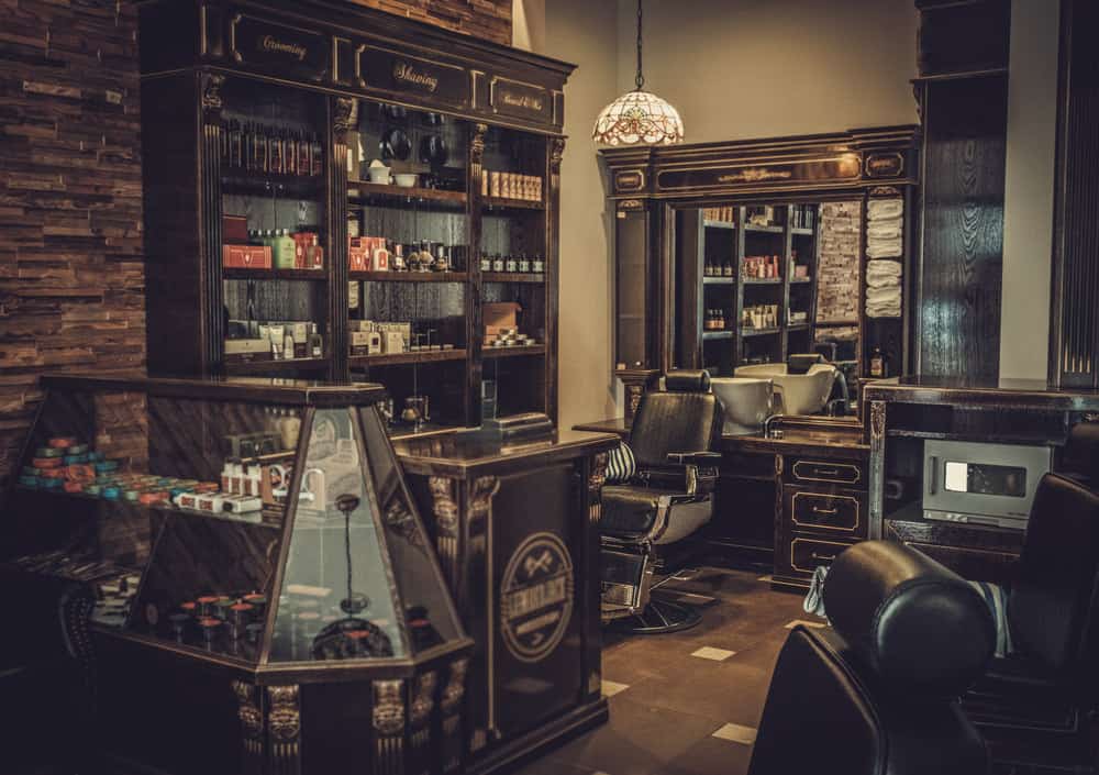 Here's a larger view of the above barber shop. Look at the detail in this vintage shop. The display case, cash register area, woodwork, old brick, Tifanny chandelier. This is one amazing design.