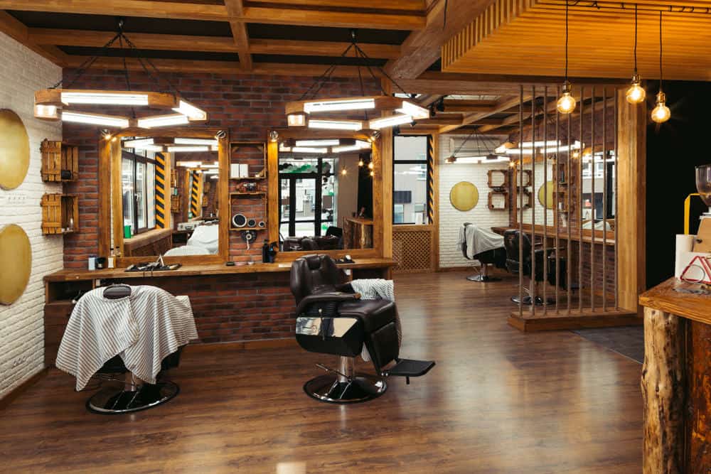 Larger view of the barbershop above. It has several station sections and certainly isn't crowded. You could easily add more stations to this space. The rustic design is great.