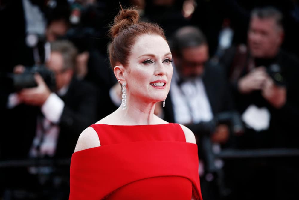 The ninth hairstyle is portrayed by actress Julianne Moore. She models a messy and muted red and auburn-colored top-knot. This hairstyle best complements those with high cheekbones and strong face shapes. 