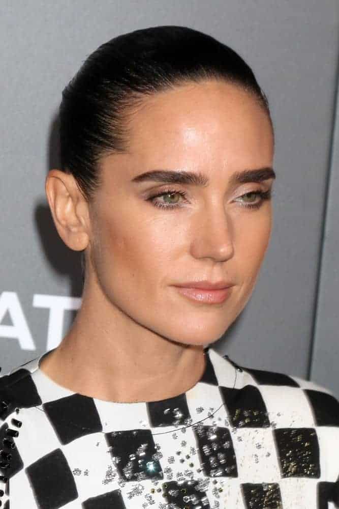 Jennifer Connelly attended the "American Pastoral" Special Screening at the Samuel Goldwyn Theater on October 13, 2016, in Beverly Hills, CA. She wore a lovely checkered dress with her slicked-back raven bun hairstyle.