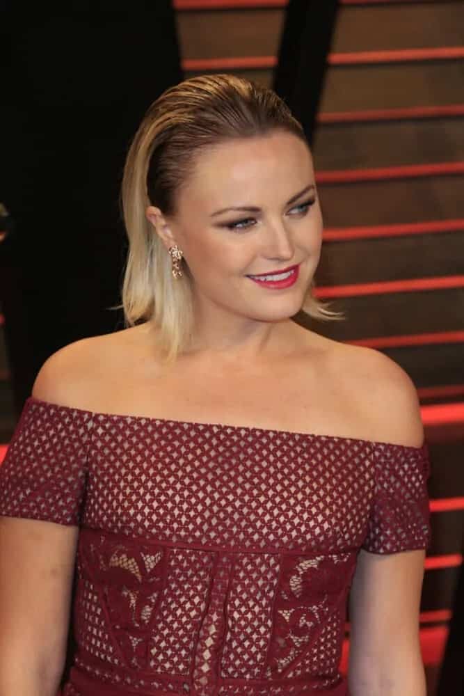 Malin Akerman totally pulled-off this medium-length slicked back hairstyle during the 2014 Vanity Fair Oscar Party wearing a maroon detailed dress and red lips.