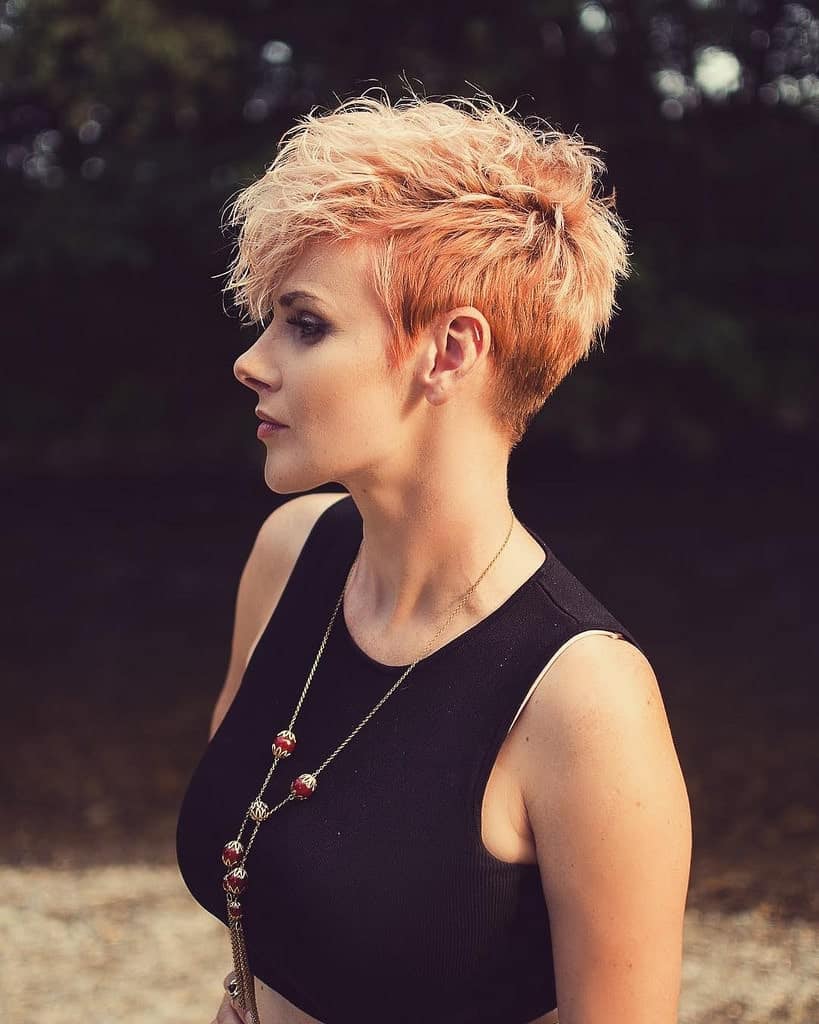 Unlike the super-straight classic pixie cut style, the feather pixie cut has the added benefit of giving your hair a bit of volume because of its feathery, fluffy texture. This one perfectly highlights this young woman’s cheek and jawbones.