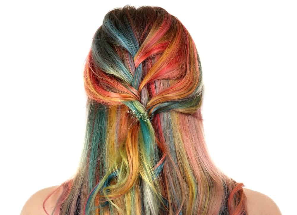 Soft waterfall braids at the back of the head are a great way to showoff colorfully dyed hair like we can see here.