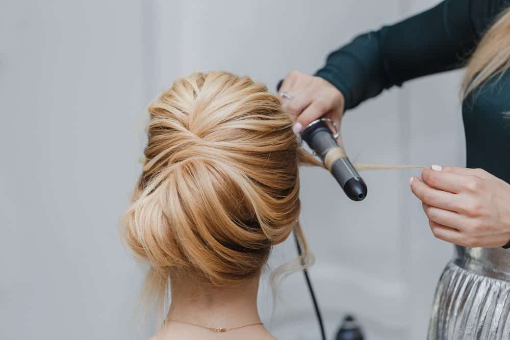 If you want a simple and elegant updo, consider getting a French twist. It’s going to add volume to your hair and you can keep it sleek or curl a few strands around your face for a softer look. 