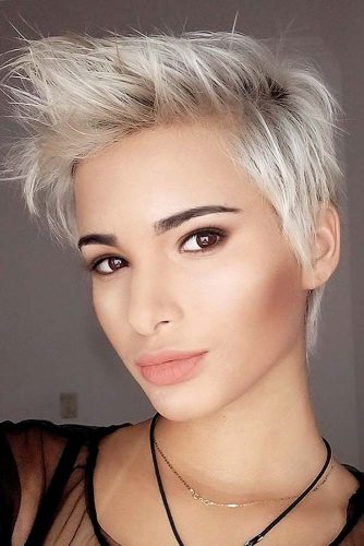 Want to get that punky, rockstar look. This pixie haircut is the perfect style for you with its pale silver strands and long, sharp frosted spikes in the front.