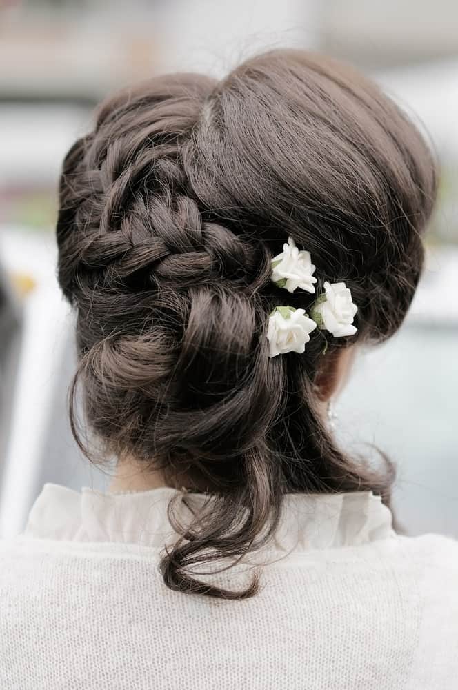 Combining a flowing braid, soft curling locks and a backcombed crown gives a beautiful result! 