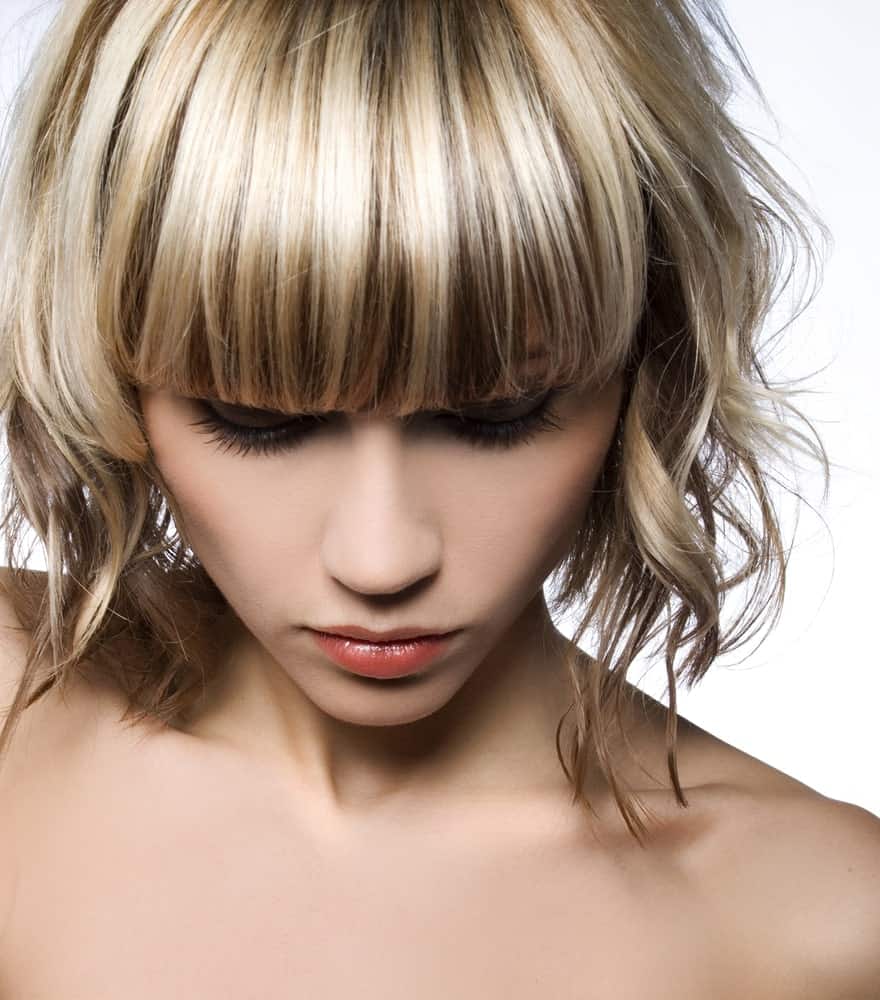 Don’t think that you can’t have a balayage just because you have cropped hair. You can sport a balayage if you have chin-length hair and bangs, with a multitude of colors like brown, platinum and dark blonde shades.