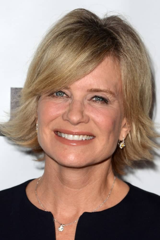 Mary Beth Evans is sporting a haircut that can look marvelous on women over 60. An outward layered bob with side bangs is all you need to add volume to your hair and give them a boost of liveliness.
