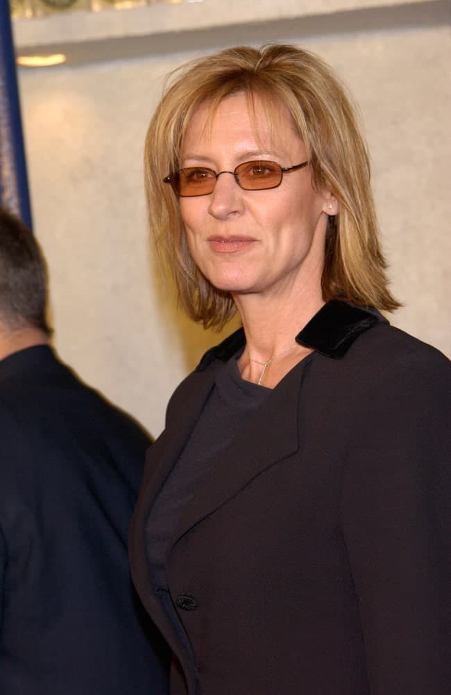 This is a simple, yet one of the most elegant hairstyles that work well for women over 50 and go beautifully with glasses. If you sporting a simple a bob cut, simply tuck the hair at the sides behind your ears and put on your glasses – you are good to go! However, keep in mind that an un-tucked Bob can also look quite impressive. 