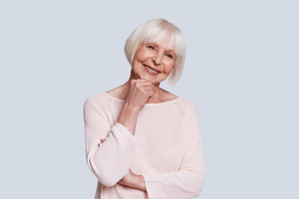 Nothing says “aging gracefully” better than this sleek, straight angled blunt bob. Add in the fringe and it simply can’t get any more stylish. In fact, it won’t be wrong to say that this hairstyle ranks quite high on the chic scale for women over 60! 