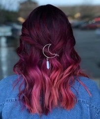 With out-of-this-world colors like plum, magenta, cherry pink and violet in this balayage, this woman’s hair looks good enough to eat.