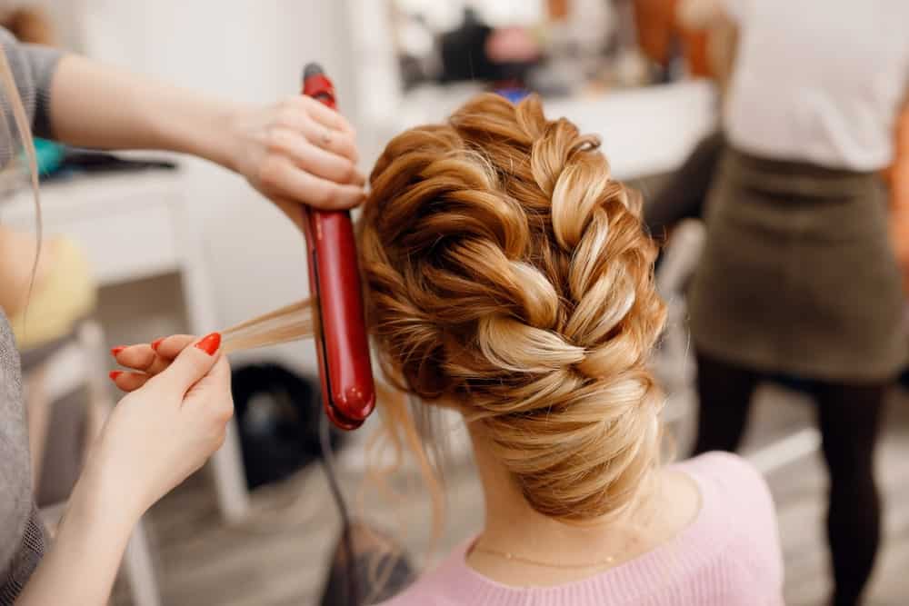 This is a perfectly trendy way to wear braids! You can begin with braids on either side of your head but end with a sleek French twist at the bottom for a gorgeous finish. 