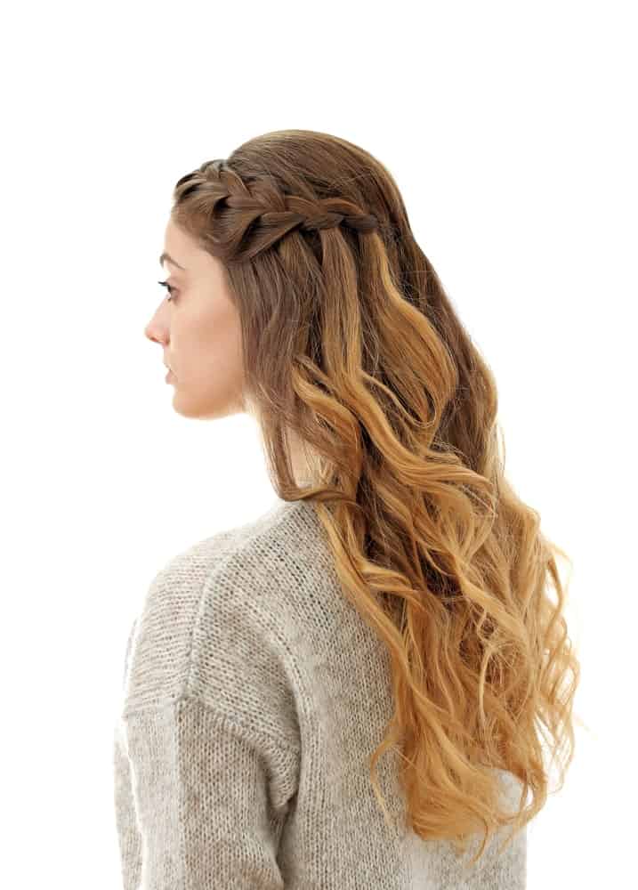 Side flowing waterfall braid is a beautiful option for longer hair. It’s easy to do and is a very pretty, feminine finish to a hairdo. The best part is that it works for any hair length and looks just as good.