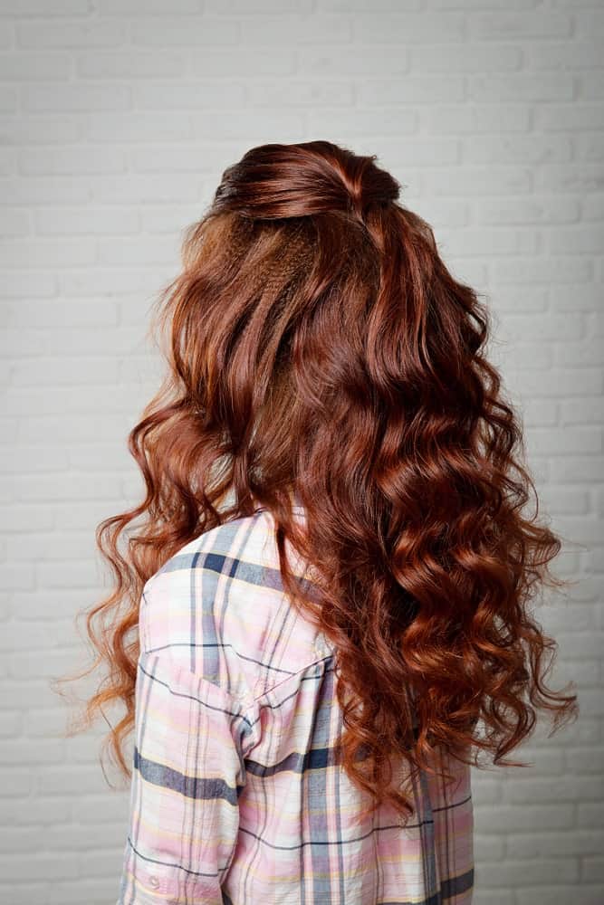 Continuing the trend of simple hairstyles, you could opt for a half up half down hairdo like this and keep things interesting by adding some tight curls to your hair for some texture. 