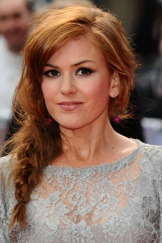 If very intricate braids are not your style, try a simpler fishtail braid for a more casual and effortless finish like Isla Fisher does here. Leaving a few strands loose gives the look a softer finish.