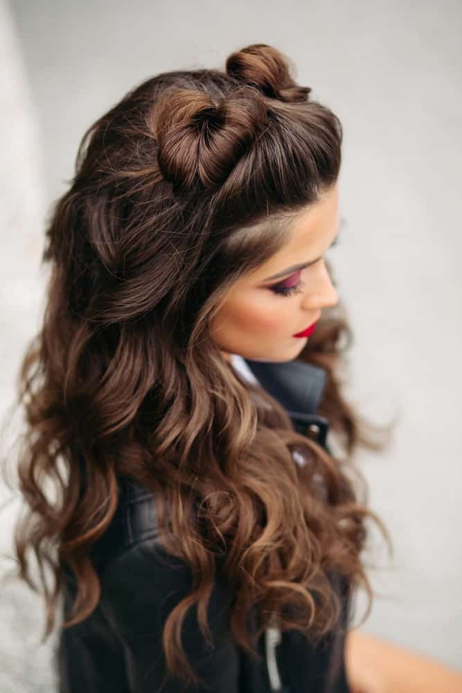 If you want to really stand out at prom, go for this hairdo with funky twisting top knots and cascading curls to accompany them. 