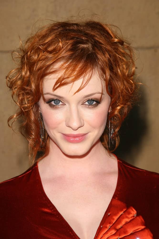 An angled bob for curly copper hair can give a very artistic, carefree look to any face shape!