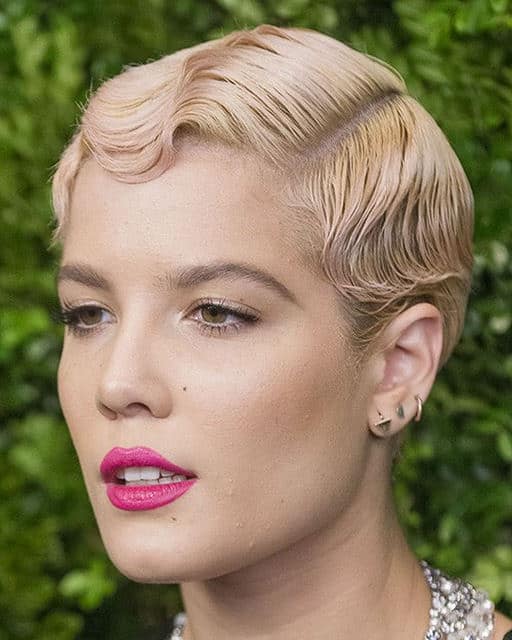 This immaculately crimped and slicked back pixie cut gives off a very ‘20s style vibe. This is a great style for people with straight and fine hair.
