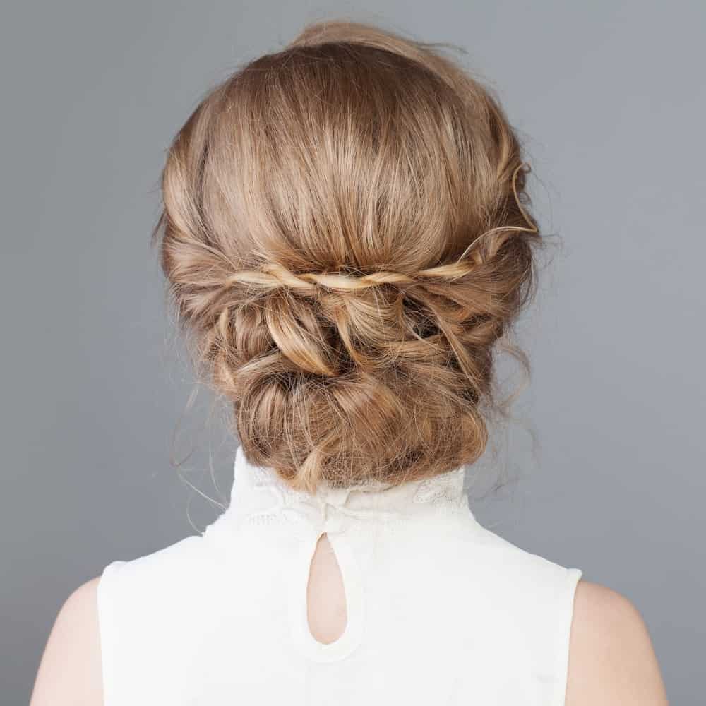 This hairstyle has a bun that incorporates some twists, braids, and some pinning. In other words, a bun that has all of our favorite things! 