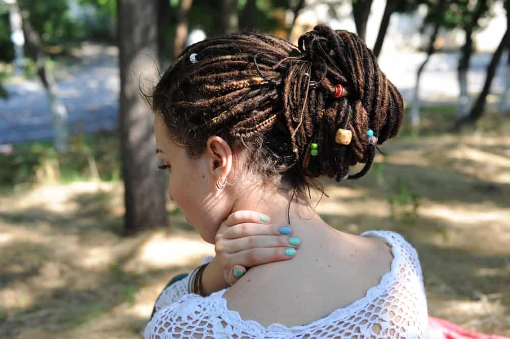 If you have dreadlocks, a great way to style them for prom is to bundle them up in a nice thick bun. It’s going to make it look elegant and trendy while keeping your hair out of the way while you get down on the dance floor! 