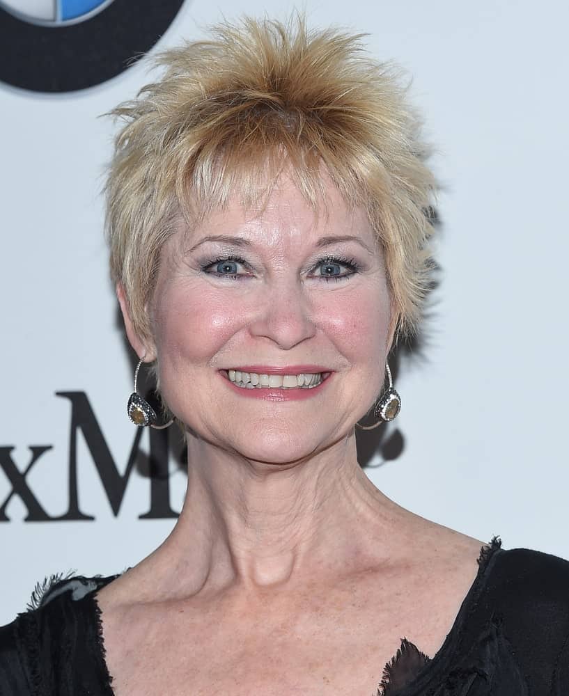 Dee Wallace is not afraid to amp things up by trying this sassy, ruffled pixie and so should be the case with you! It is the perfect haircut to add a little funk to your 60s. 