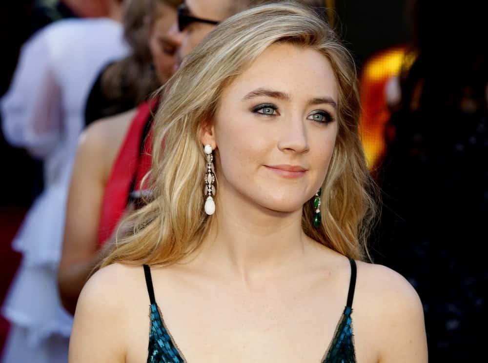 Get a naturally textured and tousled effect to your hair by using some hairspray and blow dryer. Also add some two-toned ombre effect like Saoirse Ronan that goes from an ash blonde to a cinnamon-y color at the bottom.