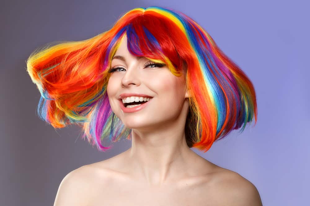 A model sporting rainbow colored hair in a bob