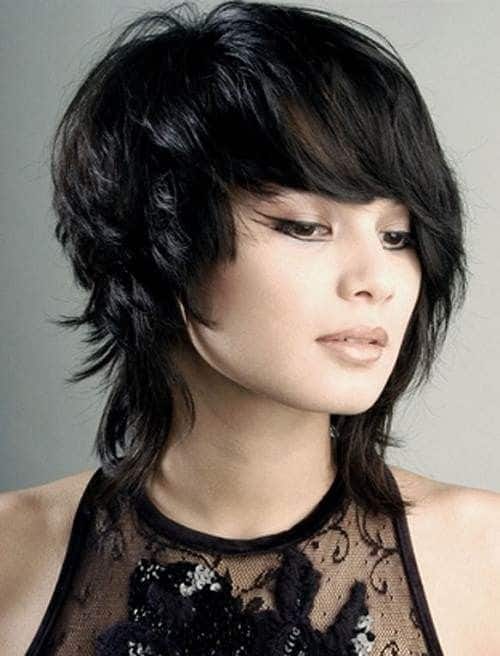 For anyone who loves bold and daring hairstyles, this is the one for them. This layered hairstyle sports quite a pixie-cut look with super short layers all over the top and slightly longer layers falling on the nape of the neck. 
