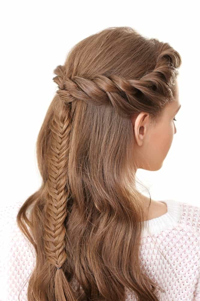 For a super pretty party or wedding hairstyle, try this beautiful crown braid hairstyle. Twist your hair from the front and then bring it to the side and then the back. Then weave the rest of the locks into a tight and intricate braid of your choice. You can either incorporate all your hair into the braid or leave half of it flowing down your back.
