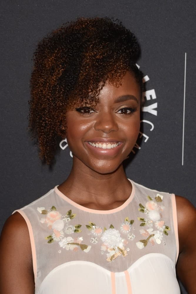 Do you know that natural hair is the best way to show off a stunning ombre? Check out Ashleigh Murray’s cute almost-black curls and the dark ruby-auburn shade she has added to give her hair more style and definition.
