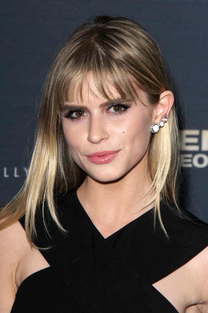 Dramatic highlights and blunt, airy separated bangs are the perfect hairstyle for women with fine hair. Go for a subtle feathered cut for even more perfection.