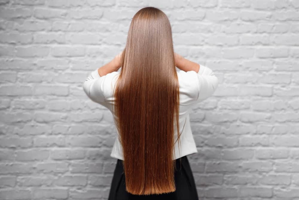 A beautiful statement balayage means you dont need to fuss with your hair that often. Ask your stylist to give your hair a beautiful, vivid color, like this chestnut-and-fox-red balayage. Just comb your long hair down your back and leave it flowing. It is perfect for all occasions.