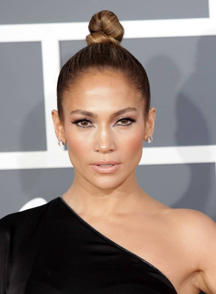 Check out this contemporary and stylish, sleek hairstyle sported by Jennifer Lopez. The hairstyle is relatively simple and ties all your hair at the top of your head in a tight bun. The end result is absolutely stunning 