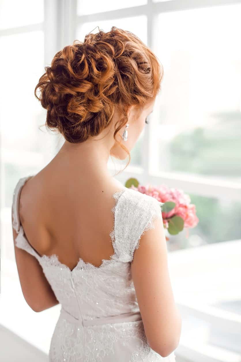 For a special event, you may want to go for an elegant bun. Messy curls can be pulled up with pins in the perfect way to help you look the best on your day. 