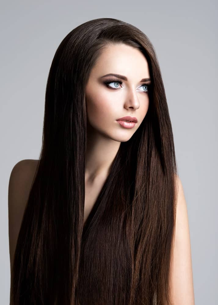 This is an absolutely gorgeous hairstyle with a side parting and more than half of the hair thrown over to the left side. If you have thick and voluminous hair, this style is perfect for you.