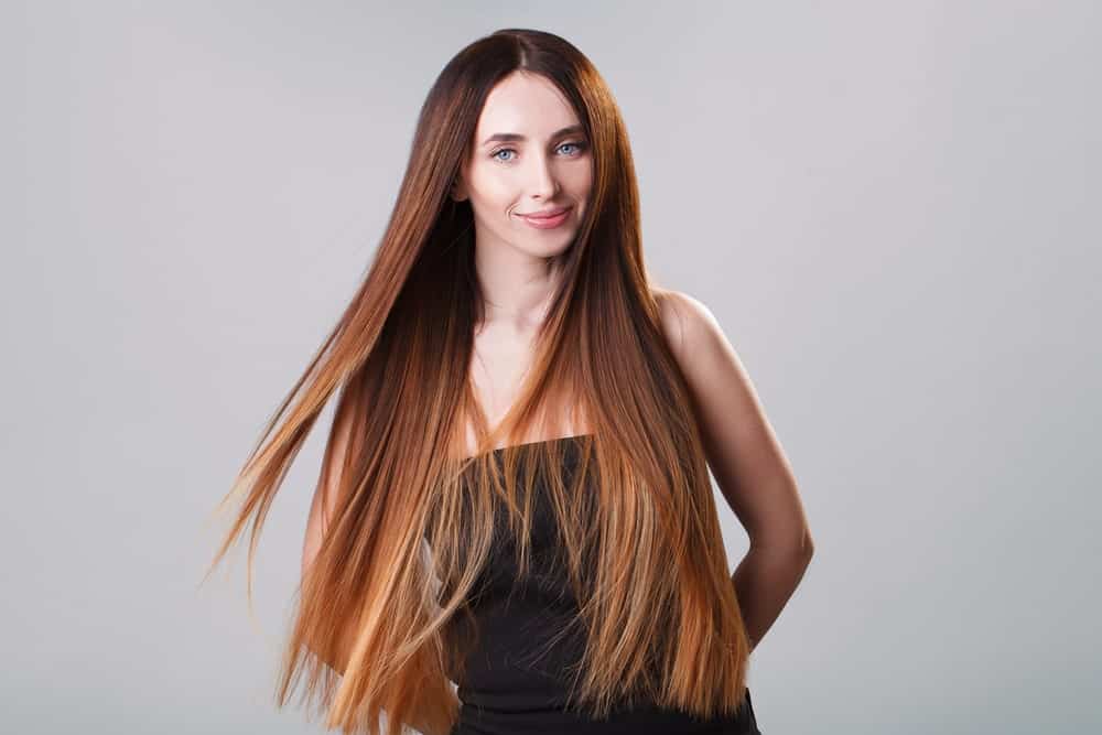 If you have super-long hair, then you have more room to play with it. Ask your stylist to transition your hair from a deep chestnut, to a dark ginger, to a fiery auburn and finally to strawberry blonde. The effect is absolutely breathtaking.