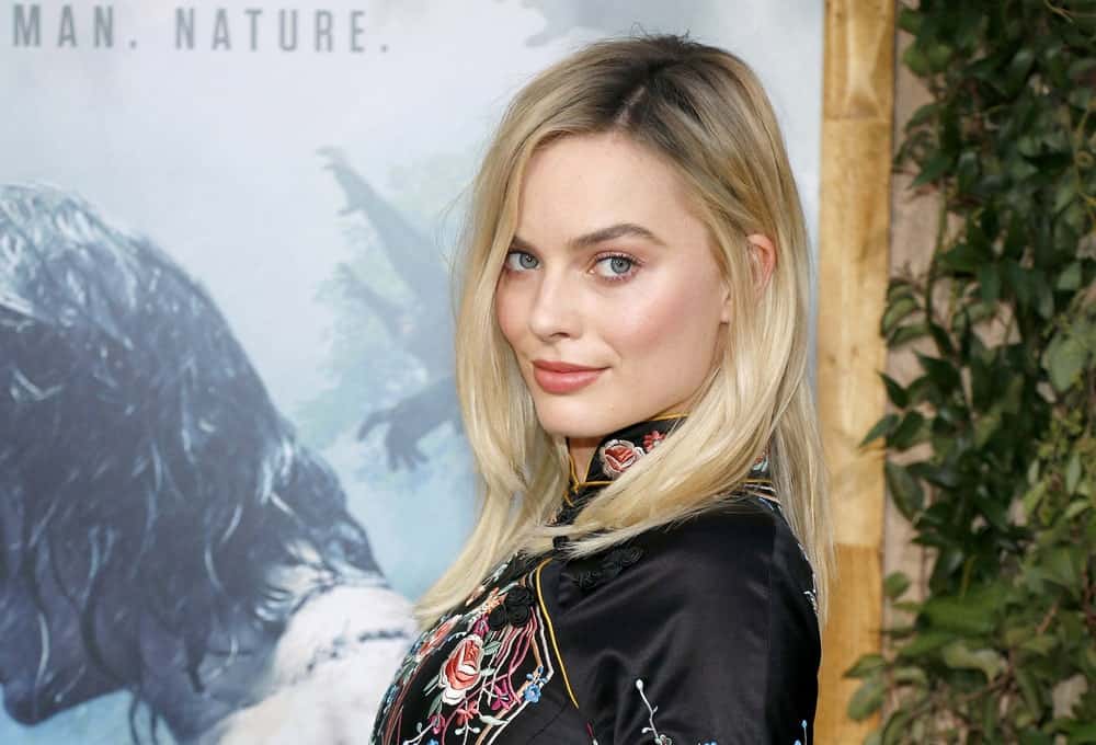Although Margot Robbie is known for her golden locks, the “I, Tonya” actress has tried almost every color, from brunette to red to blonde. Here, Robbie rocks a super-smart look with her signature creamy gold hair but with darker roots.