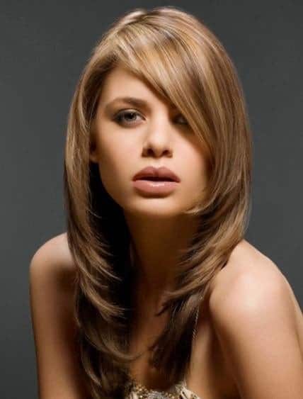 These are inward-going, long layers with side bangs and a gorgeous honey-brown hair dye that gives it a very sophisticated look.  