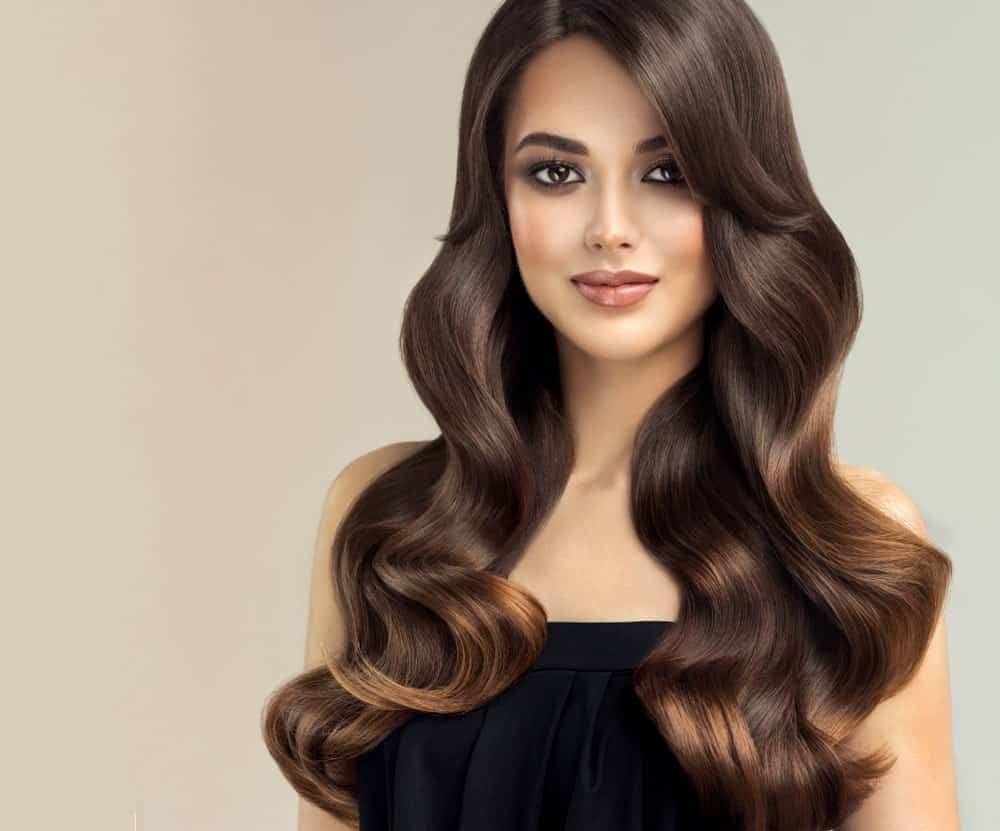 Do you want to add dimension, definition and volume to your hair, without too much drama? Here is the perfect way to do it. Add some subtle but glamorous fiery gold highlights to a background of rich dark hair. The stunning highlights will reflect the light and turn heads at the best moments.