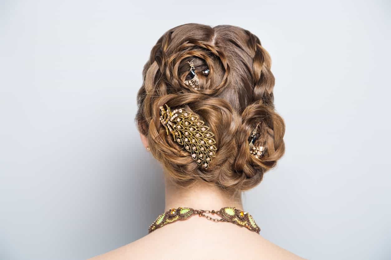 Looking for hairspiration for your wedding? If you have thick and long hair, try a super-intricate hairstyle with lots of braids, multiple twists, and curls in your hair. Embellish it with jeweled accessories.