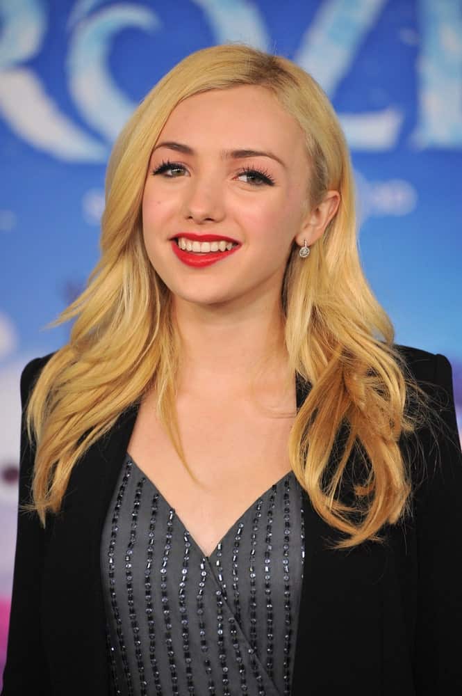 This is the super cute actress Peyton List rocking her layered hairstyle at the movie premier of Frozen. This hairstyle has pretty golden layers that have been styled outwards and also has a side parting. It is a very simple yet decent layered look. 
