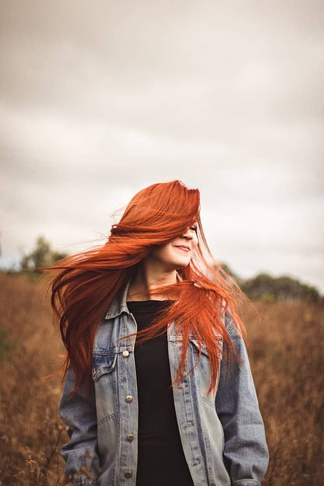 A red-headed woman with fine hair? No one can look more stunning with their natural hair!